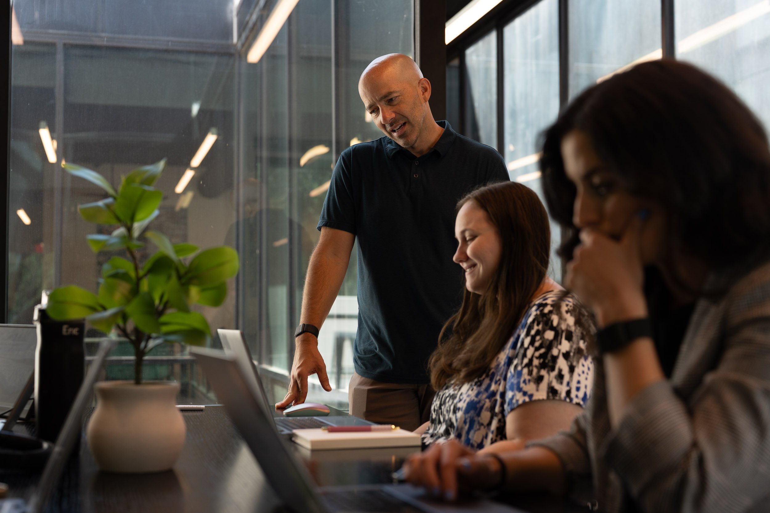 Exos teammates collaborating in an office setting