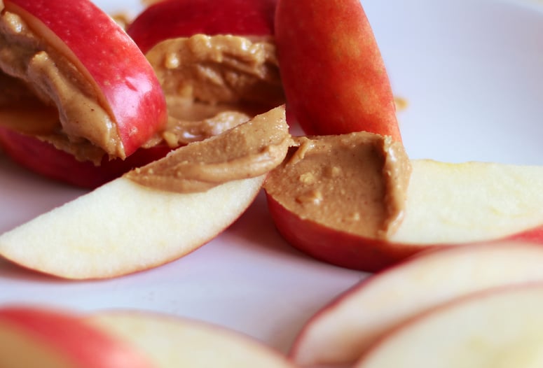 Apple slices with nut butter — one of Exos Coach Eric's favorite healthy snacks.