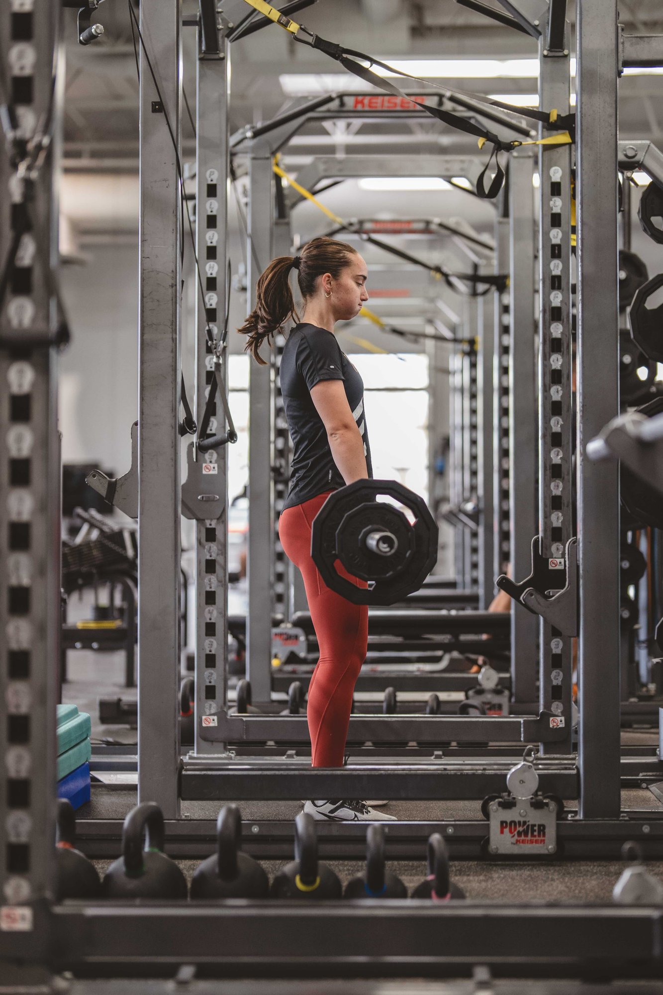 A college athlete lifts weights at Exos Phoenix performance center