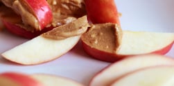 Apple slices with nut butter, one of Exos Coach Eric's favorite healthy snacks.
