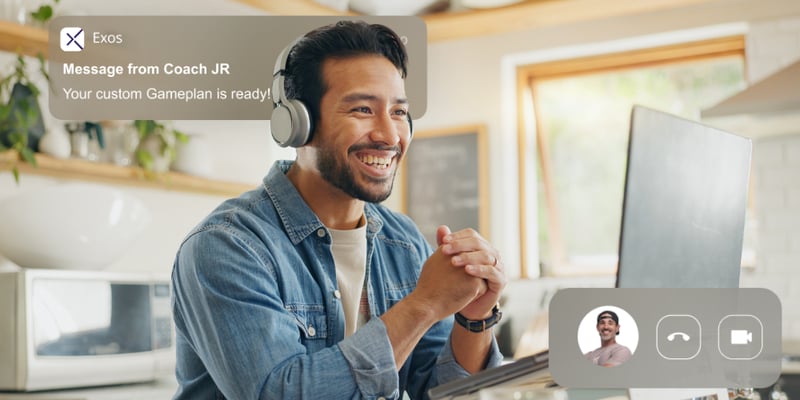 Man with headphones chats with his virtual Exos coach, receiving a notification that his custom Gameplan is ready.