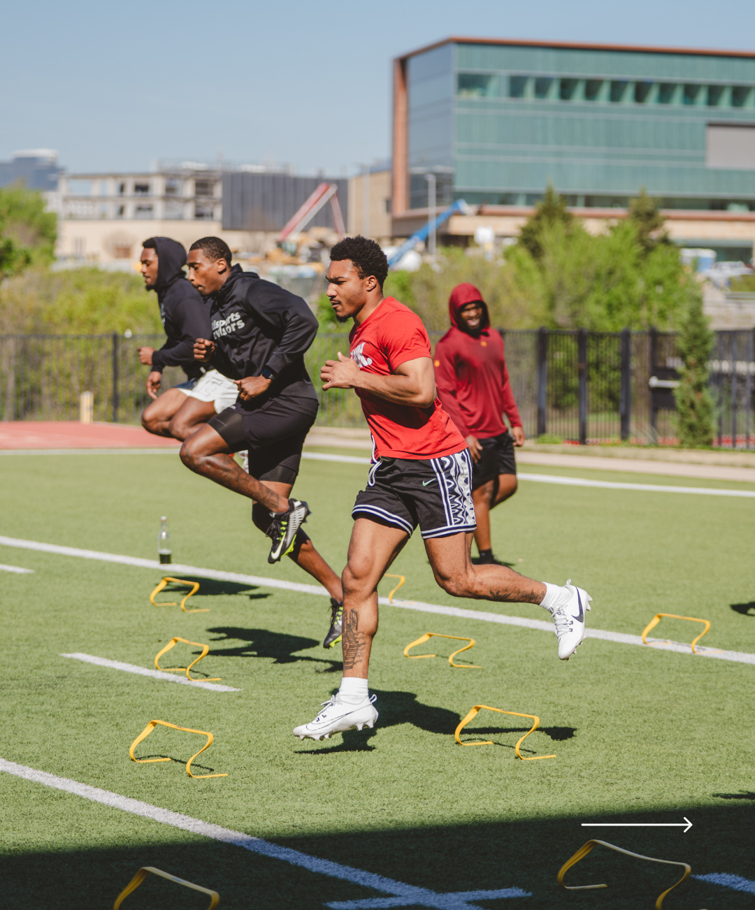 exos-plano-athletes-on-outdoor-turf