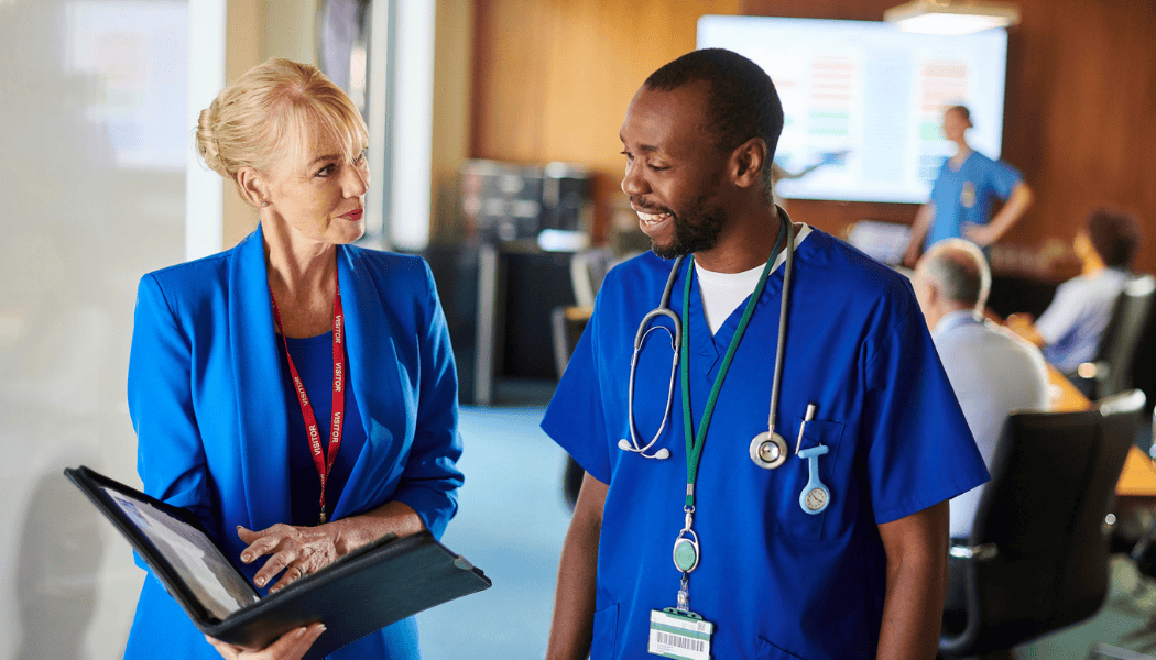 Traveling medical sales professional connecting with a doctor in a healthcare setting.