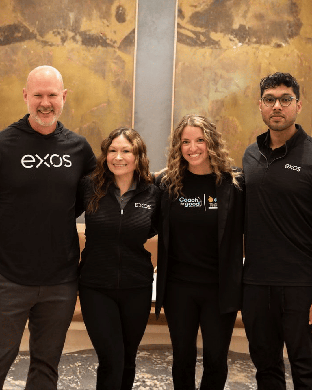 Exos team members smiling for a photo, ready to assist with ongoing operations.