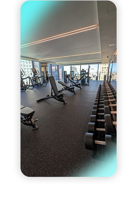 A modern office fitness center, thoughtfully designed in a high-rise building.